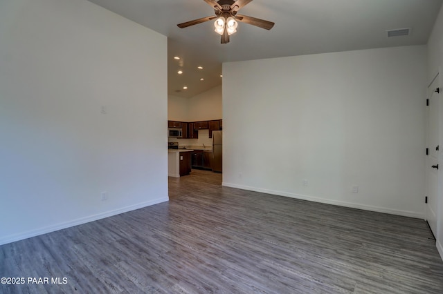 8346 Florentine Rd, Prescott Valley, AZ 86314 - unfurnished living room with ceiling fan, wood finished floors, recessed lighting, and high vaulted ceiling