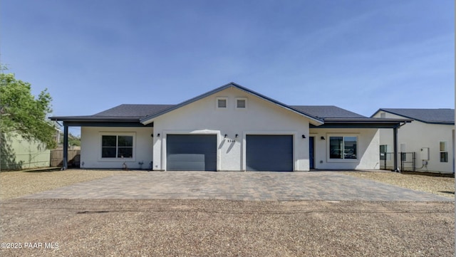 8346 Florentine Rd, Prescott Valley, AZ 86314 - view of front of property with a garage, decorative driveway, and stucco siding