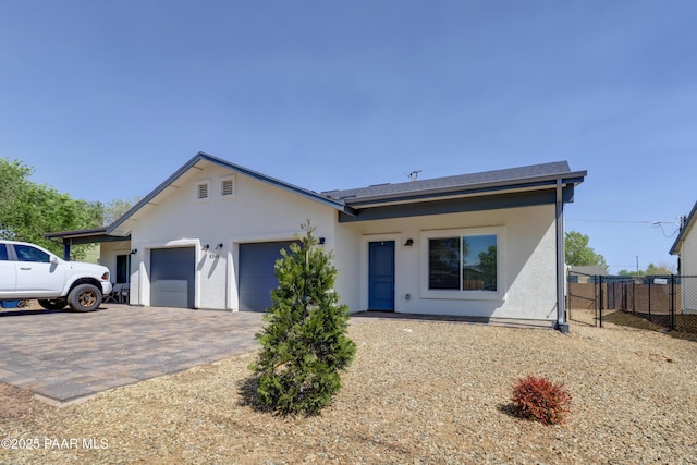 8346 Florentine Rd, Prescott Valley, AZ 86314 - view of front facade with a garage, decorative driveway, and stucco siding