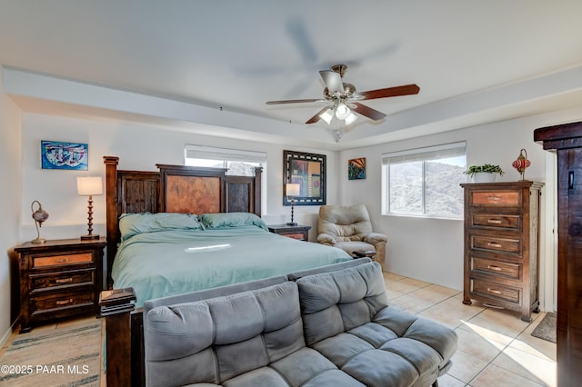 bedroom with a ceiling fan and light tile patterned floors