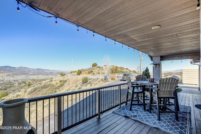 wooden deck with a mountain view