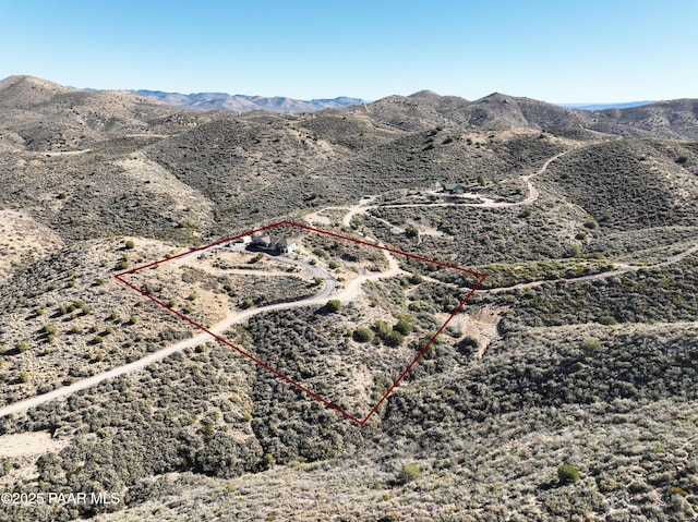 drone / aerial view featuring a mountain view