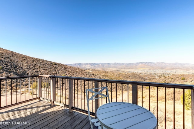 wooden terrace featuring a mountain view