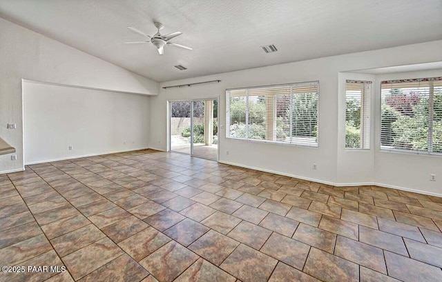 7461 N Windy Walk Way, Prescott Valley, AZ 86315 - empty room with healthy amount of natural light, vaulted ceiling, ceiling fan, and tile patterned floors