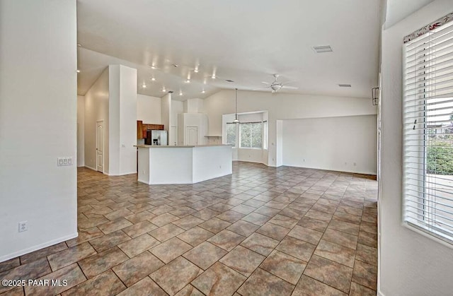 7461 N Windy Walk Way, Prescott Valley, AZ 86315 - unfurnished living room featuring vaulted ceiling and ceiling fan