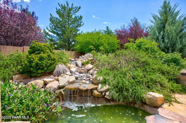 7461 N Windy Walk Way, Prescott Valley, AZ 86315 - view of yard with a small pond