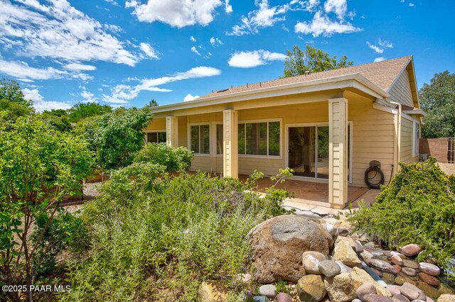 7461 N Windy Walk Way, Prescott Valley, AZ 86315 - view of front of property with a patio and roof with shingles