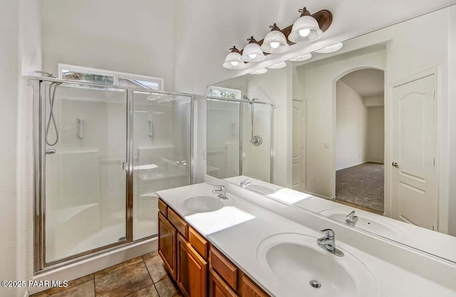 7461 N Windy Walk Way, Prescott Valley, AZ 86315 - bathroom with a stall shower and double vanity