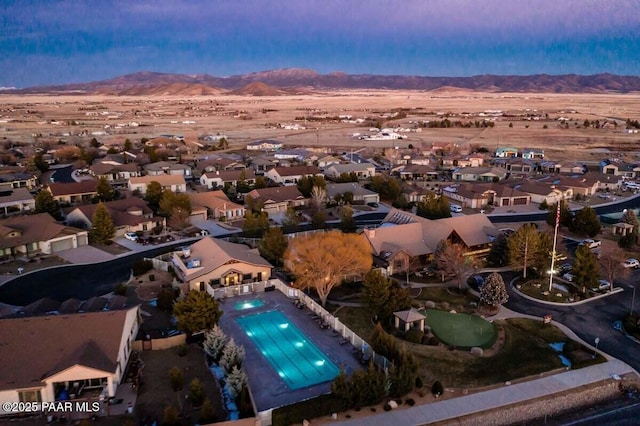 7461 N Windy Walk Way, Prescott Valley, AZ 86315 - aerial perspective of suburban area with a mountainous background and a pool