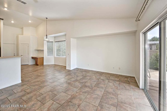 7461 N Windy Walk Way, Prescott Valley, AZ 86315 - unfurnished living room with healthy amount of natural light and high vaulted ceiling