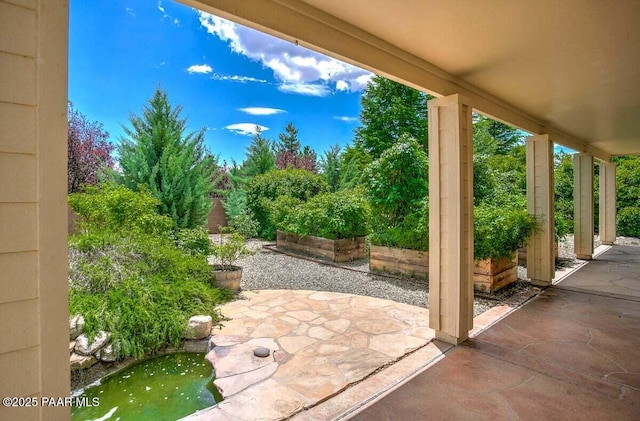 7461 N Windy Walk Way, Prescott Valley, AZ 86315 - view of patio featuring a garden pond