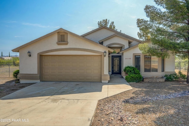 20100 E Mesa Verde Rd, Mayer, AZ 86333 - ranch-style home featuring stucco siding, driveway, and an attached garage