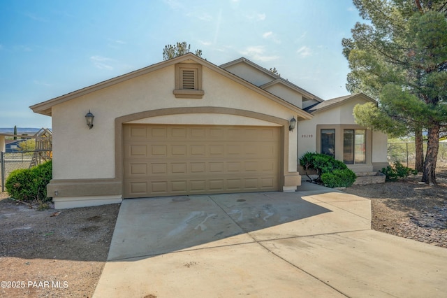 20100 E Mesa Verde Rd, Mayer, AZ 86333 - view of front of house with stucco siding, concrete driveway, and a garage
