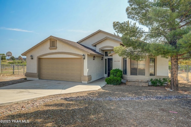 20100 E Mesa Verde Rd, Mayer, AZ 86333 - view of front of property featuring stucco siding, a garage, and concrete driveway