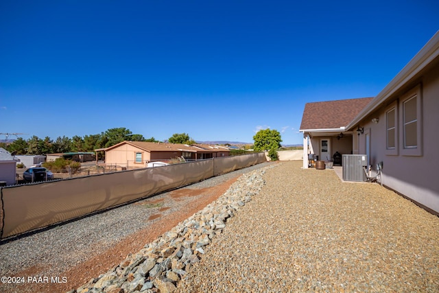 view of yard featuring central air condition unit