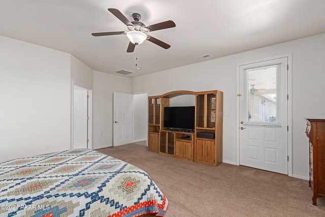 carpeted bedroom featuring ceiling fan