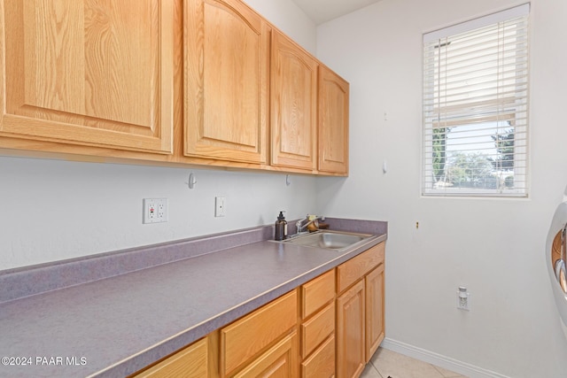 interior space featuring light tile patterned flooring and sink