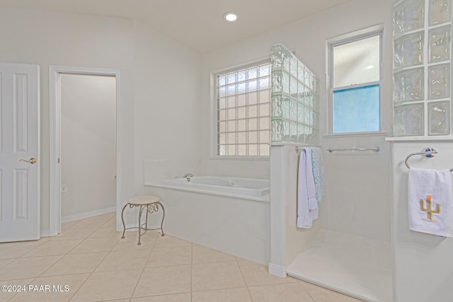 bathroom with tile patterned flooring and independent shower and bath