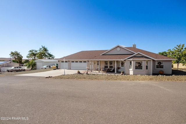 view of front of house with a porch and a garage