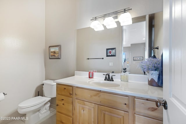 bathroom with tile patterned floors, vanity, and toilet