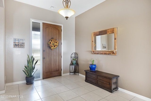 foyer entrance featuring light tile patterned floors