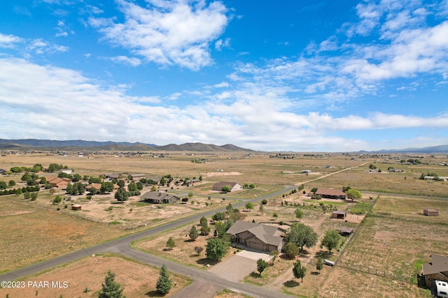 drone / aerial view with a mountain view and a rural view