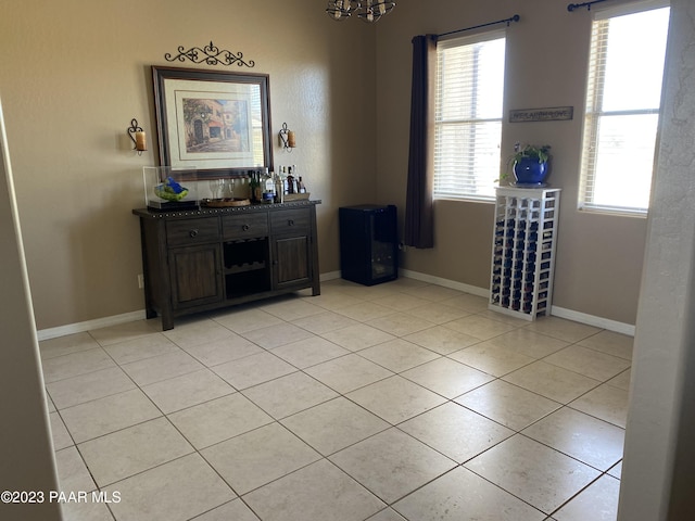 interior space with a chandelier and light tile patterned floors