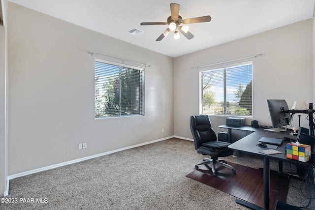 office space with carpet flooring, a wealth of natural light, and ceiling fan