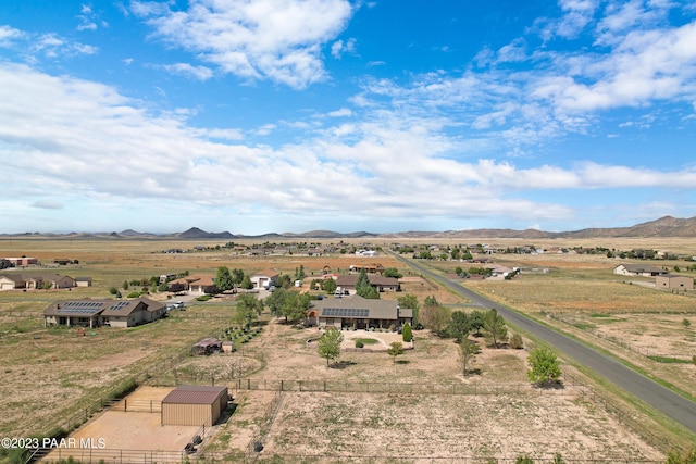 birds eye view of property with a mountain view