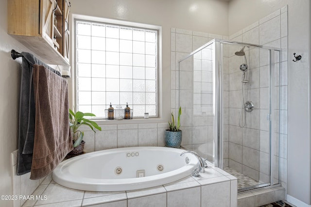 bathroom with independent shower and bath