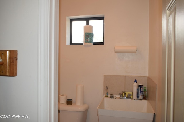 bathroom with sink and toilet