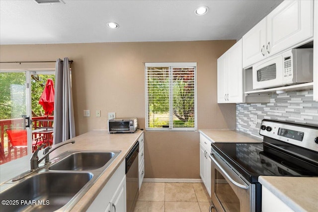 3050 Smokey Rd Unit 20D, Prescott, AZ 86301 - kitchen featuring stainless steel appliances, backsplash, white cabinetry, and recessed lighting