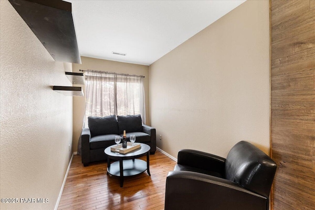 3050 Smokey Rd Unit 20D, Prescott, AZ 86301 - living area with hardwood / wood-style floors and a textured wall