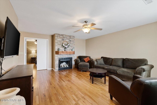 3050 Smokey Rd Unit 20D, Prescott, AZ 86301 - living area featuring a ceiling fan, light wood finished floors, and a fireplace
