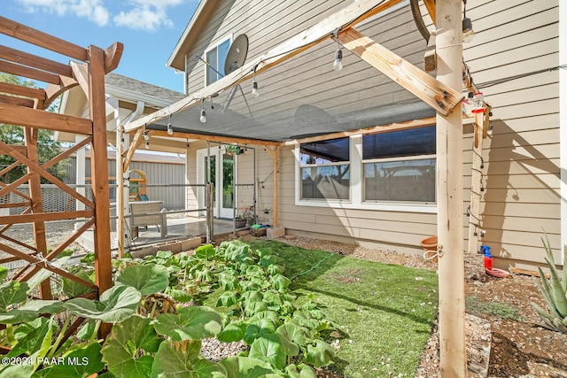 view of property exterior with a pergola and a patio area