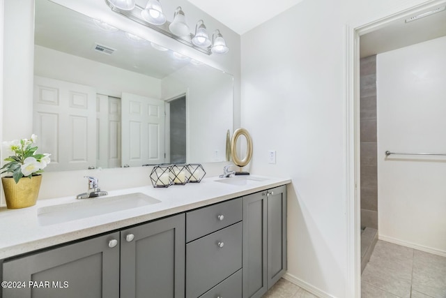 bathroom featuring tile patterned flooring and vanity