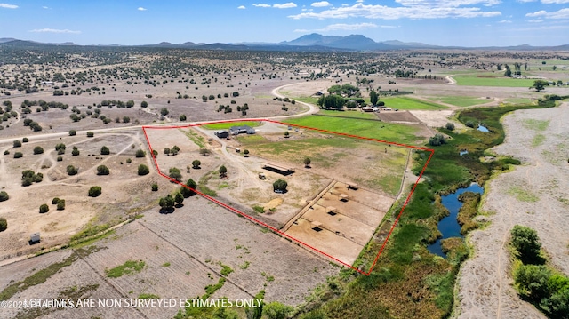 bird's eye view with a mountain view and a rural view