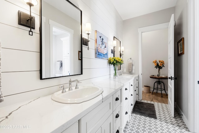 full bath with double vanity and a sink