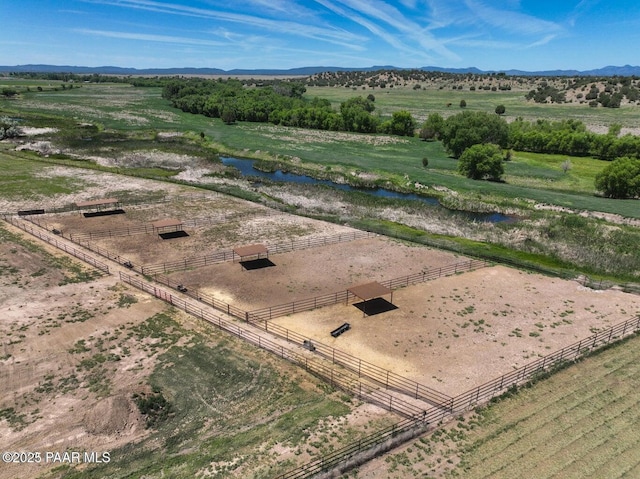 aerial view with a rural view and a water and mountain view