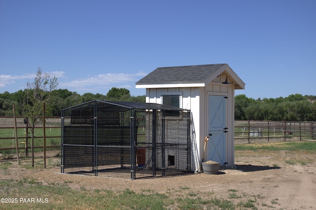 view of outdoor structure with an outdoor structure and fence