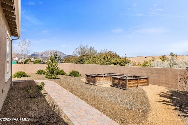848 Royal Tulips St, Prescott, AZ 86301 - view of patio with a mountain view, a fenced backyard, and a garden