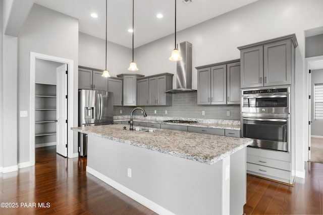 848 Royal Tulips St, Prescott, AZ 86301 - kitchen with a sink, gray cabinets, stainless steel appliances, wall chimney exhaust hood, and dark wood-type flooring