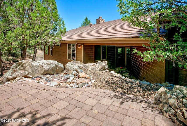 2140 Lone Oak Way, Prescott, AZ 86305 - view of front facade featuring a patio area, a chimney, and a tiled roof