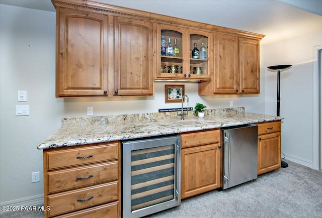2140 Lone Oak Way, Prescott, AZ 86305 - kitchen featuring beverage cooler, refrigerator, light stone countertops, glass insert cabinets, and light colored carpet