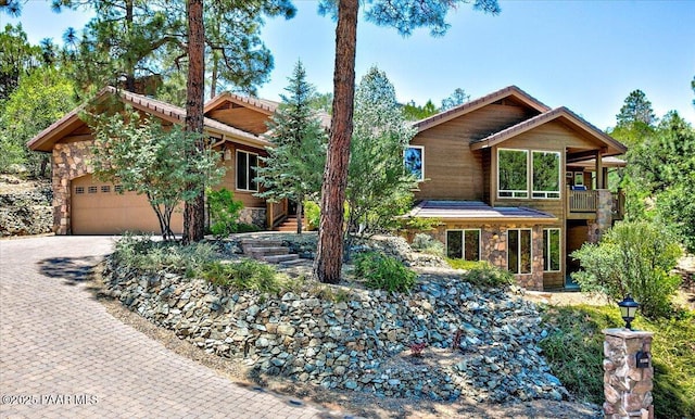 2140 Lone Oak Way, Prescott, AZ 86305 - view of front facade with stone siding, decorative driveway, a garage, a balcony, and stairs