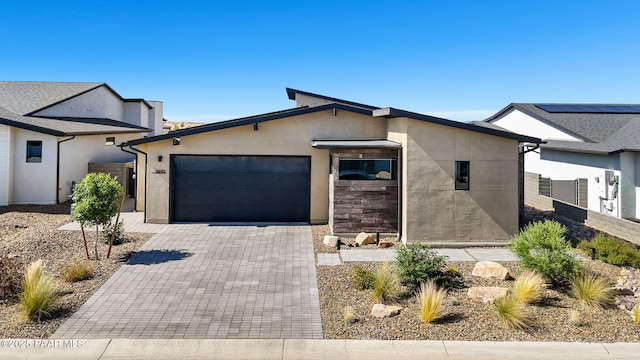 5692 E Cannon Pl, Prescott Valley, AZ 86314 - view of front facade featuring an attached garage, stucco siding, and decorative driveway