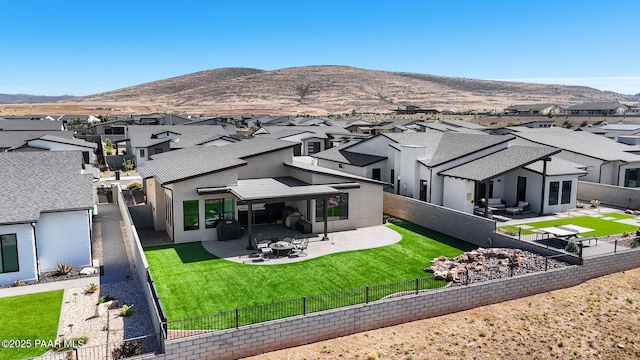 5692 E Cannon Pl, Prescott Valley, AZ 86314 - back of property featuring a residential view, a fenced backyard, a patio area, and a mountain view
