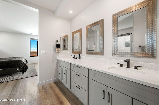 5692 E Cannon Pl, Prescott Valley, AZ 86314 - bathroom featuring double vanity, wood finished floors, connected bathroom, and recessed lighting