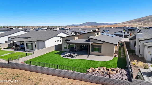 5692 E Cannon Pl, Prescott Valley, AZ 86314 - back of house featuring a residential view, a patio, stucco siding, and a fenced backyard