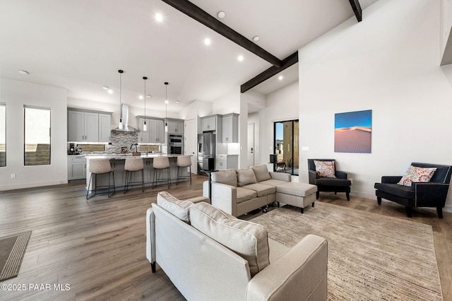 5692 E Cannon Pl, Prescott Valley, AZ 86314 - living room with beamed ceiling, light wood-style floors, high vaulted ceiling, and recessed lighting